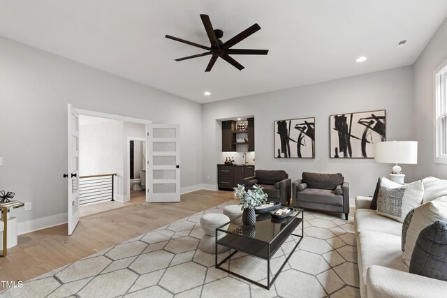 5812 Shawood Dr, Raleigh, NC 27609 - living area featuring light wood finished floors, ceiling fan, recessed lighting, and baseboards