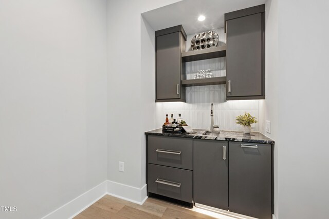 5812 Shawood Dr, Raleigh, NC 27609 - indoor bar featuring tasteful backsplash, baseboards, and light wood-type flooring