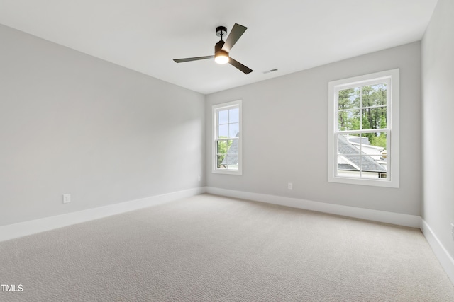5812 Shawood Dr, Raleigh, NC 27609 - spare room featuring baseboards, a ceiling fan, and light carpet