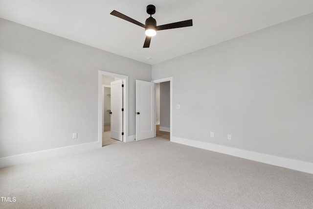 5812 Shawood Dr, Raleigh, NC 27609 - unfurnished bedroom with light colored carpet, baseboards, and ceiling fan