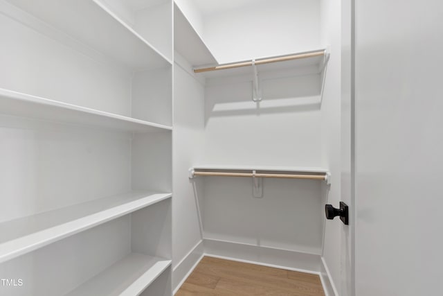 5812 Shawood Dr, Raleigh, NC 27609 - walk in closet featuring wood finished floors