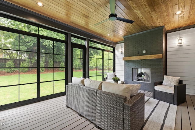 5812 Shawood Dr, Raleigh, NC 27609 - sunroom / solarium featuring ceiling fan, an outdoor living space with a fireplace, and healthy amount of natural light
