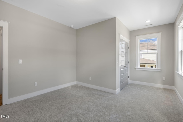 210 Colvard Farms Rd, Durham, NC 27713 - unfurnished bedroom featuring baseboards, visible vents, light carpet, and recessed lighting