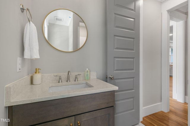 210 Colvard Farms Rd, Durham, NC 27713 - bathroom featuring vanity, visible vents, wood finished floors, and baseboards