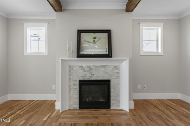 room details with a brick fireplace, crown molding, beamed ceiling, and hardwood / wood-style floors