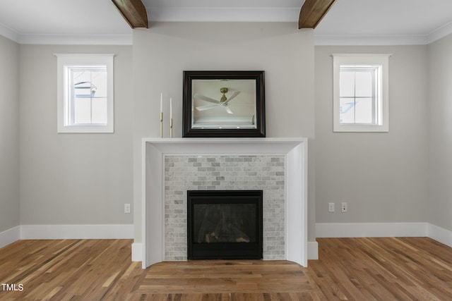 210 Colvard Farms Rd, Durham, NC 27713 - details featuring beamed ceiling, ornamental molding, wood finished floors, and a fireplace