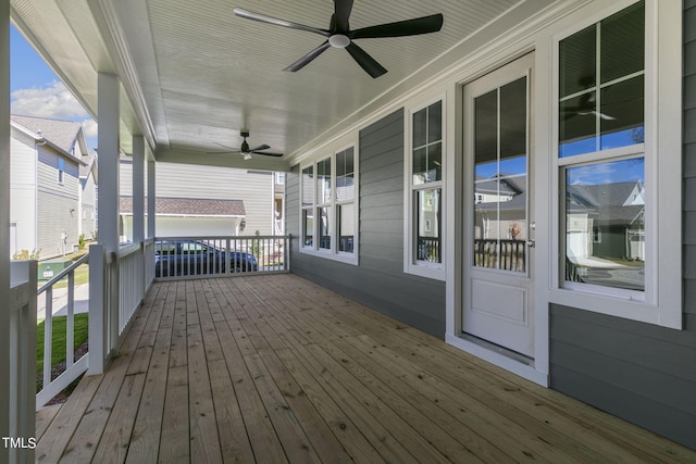 deck featuring covered porch and ceiling fan