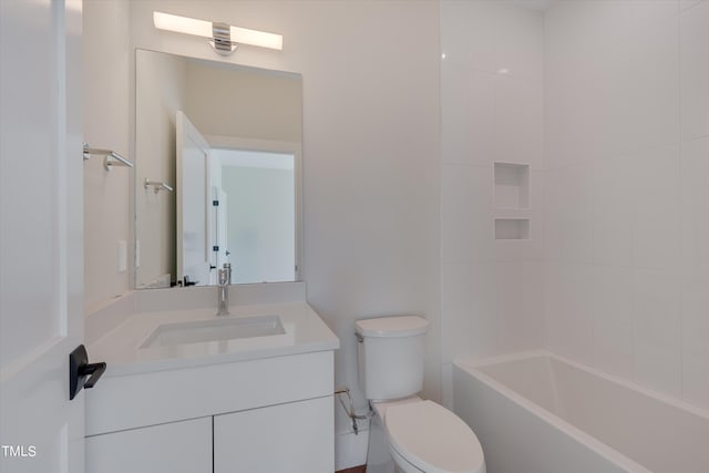 full bathroom with tiled shower / bath combo, vanity, and toilet