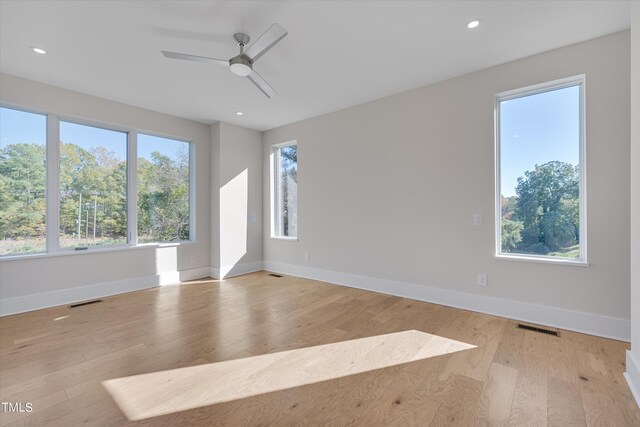 unfurnished room with ceiling fan and light hardwood / wood-style flooring