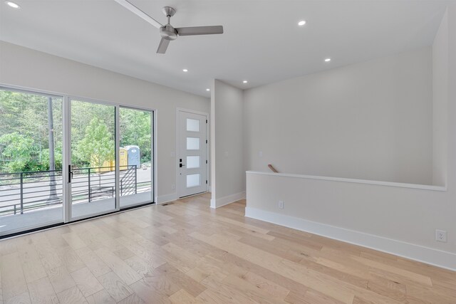 empty room featuring light wood-type flooring and ceiling fan