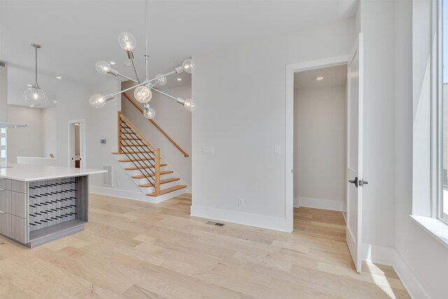 unfurnished living room with light hardwood / wood-style floors