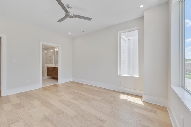 unfurnished bedroom featuring light hardwood / wood-style flooring, ceiling fan, and ensuite bath