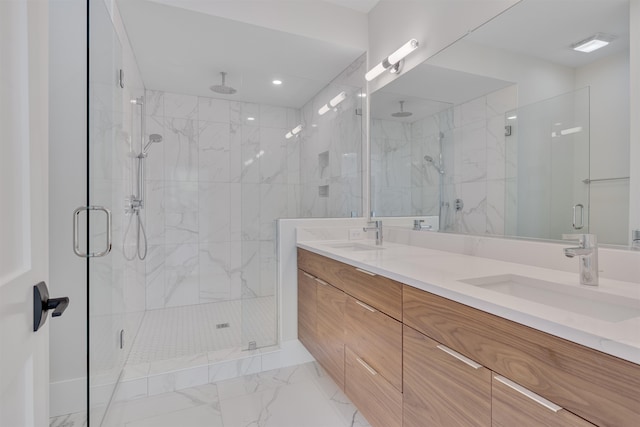 bathroom with vanity and a shower with shower door