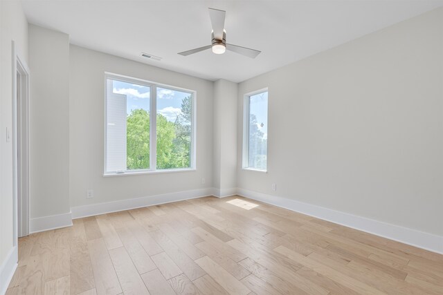 unfurnished room with ceiling fan and light hardwood / wood-style flooring