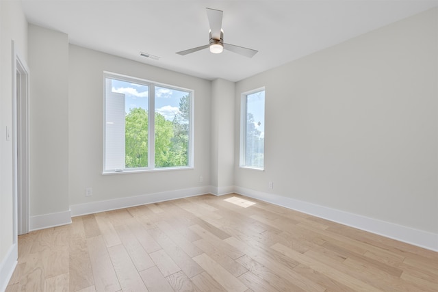 unfurnished room with ceiling fan and light hardwood / wood-style floors