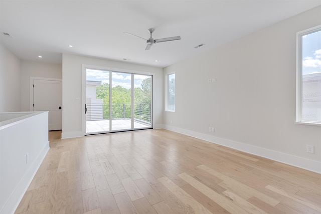 unfurnished room with ceiling fan and light wood-type flooring