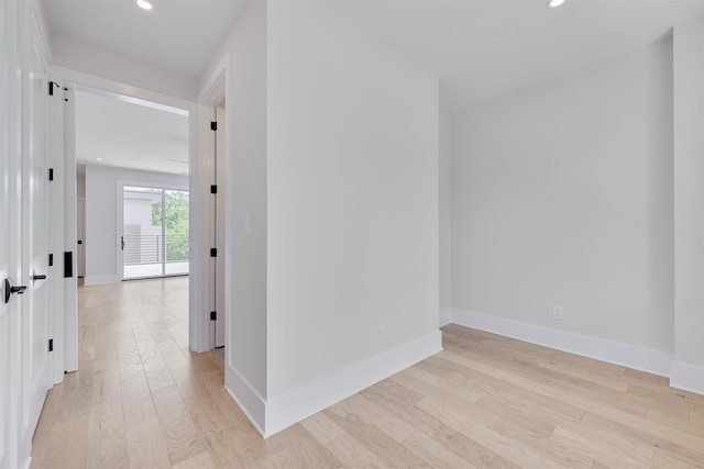 hall with light hardwood / wood-style floors