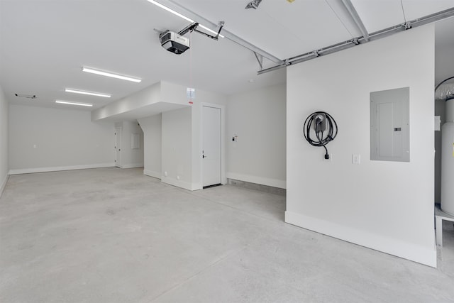 garage with a garage door opener and electric panel