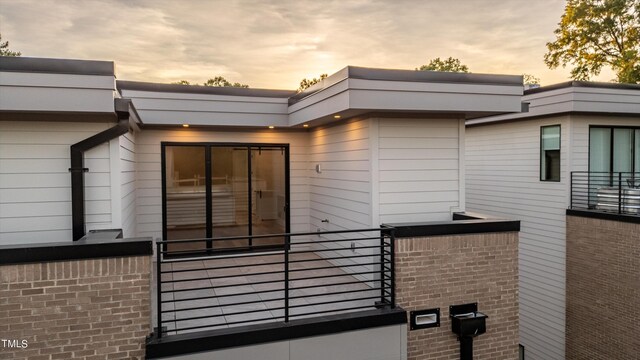 view of property exterior at dusk