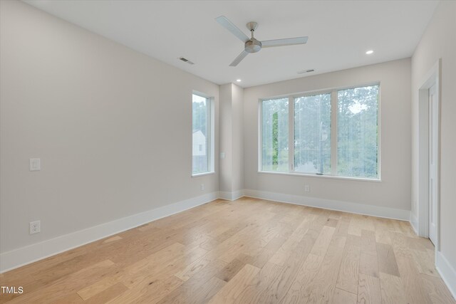 empty room featuring ceiling fan and light wood-type flooring