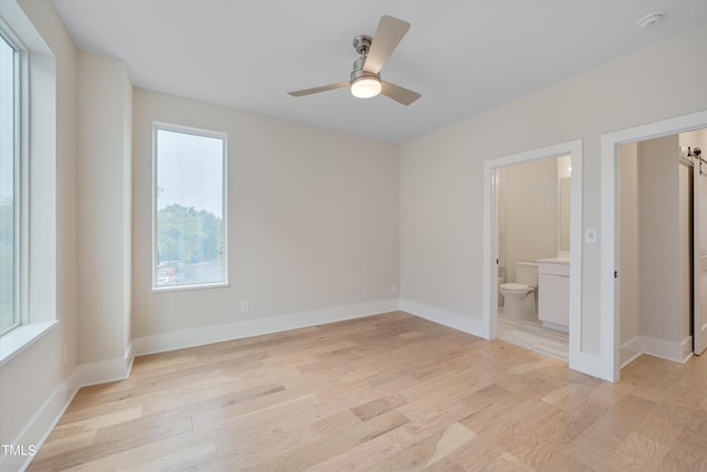 spare room featuring ceiling fan and light hardwood / wood-style floors