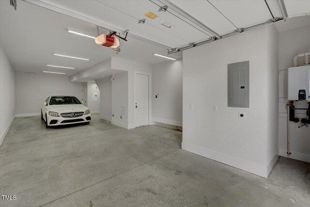 garage featuring a garage door opener, electric panel, and water heater