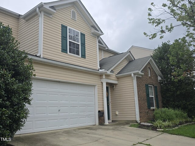 front facade with a garage