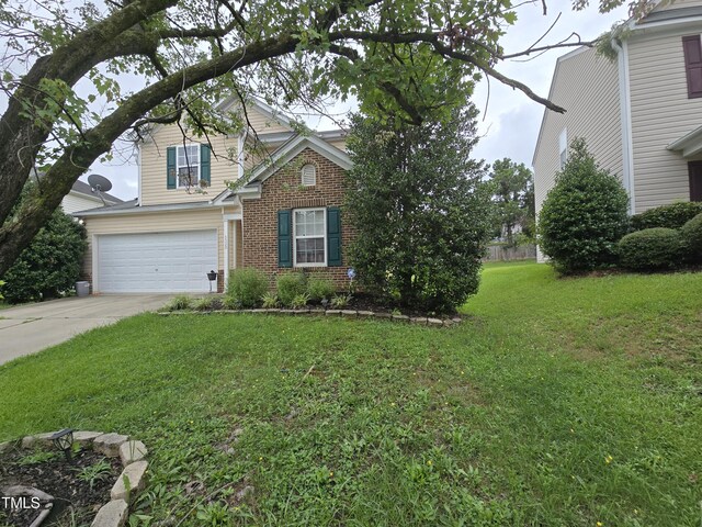 view of front of property featuring a garage and a front yard