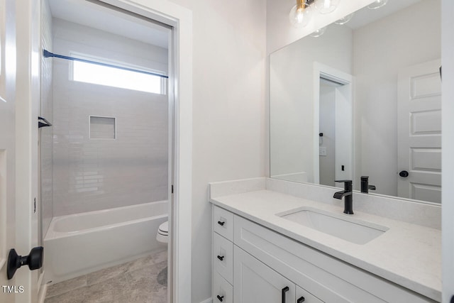 full bathroom featuring bathing tub / shower combination, vanity, tile patterned floors, and toilet