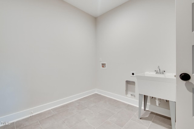 clothes washing area featuring hookup for a washing machine, light tile patterned flooring, and hookup for an electric dryer