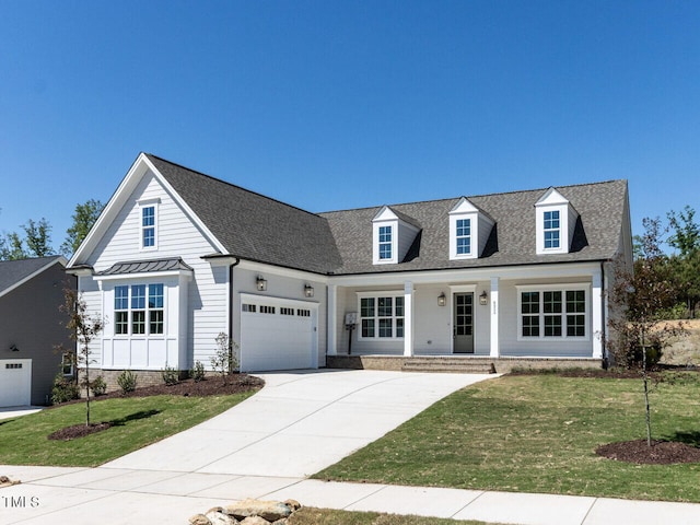 6052 Scalybark Rd, Durham, NC 27712 - view of front facade featuring a porch, concrete driveway, a front yard, and a garage