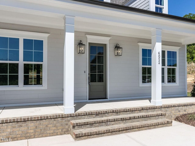 6052 Scalybark Rd, Durham, NC 27712 - doorway to property with covered porch