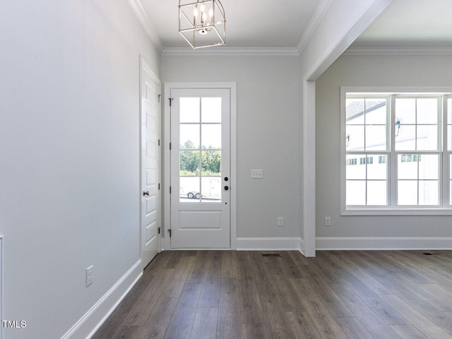 6052 Scalybark Rd, Durham, NC 27712 - doorway with ornamental molding, dark wood-style floors, visible vents, and a chandelier