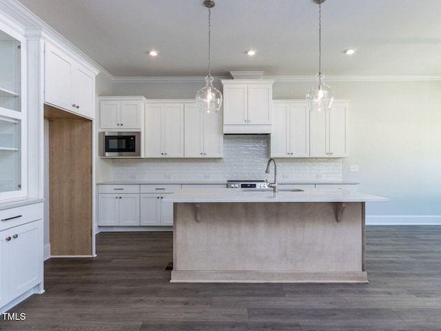 6052 Scalybark Rd, Durham, NC 27712 - kitchen featuring a sink, stainless steel microwave, white cabinets, and ornamental molding