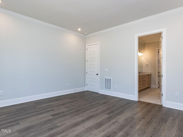 6052 Scalybark Rd, Durham, NC 27712 - unfurnished bedroom with visible vents, crown molding, baseboards, dark wood-style floors, and recessed lighting