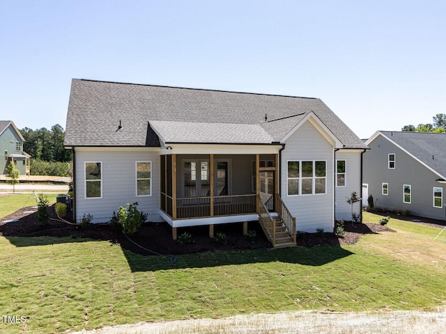 6052 Scalybark Rd, Durham, NC 27712 - view of front of home featuring a shingled roof, a sunroom, and a front yard