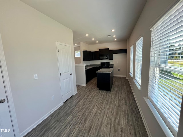 kitchen featuring dark hardwood / wood-style floors and a center island