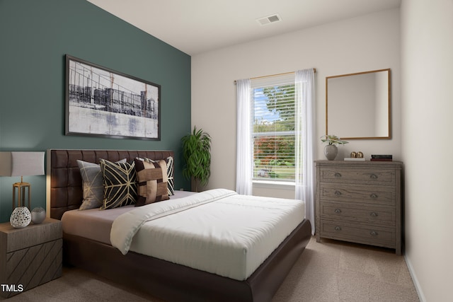 carpeted bedroom featuring visible vents and baseboards