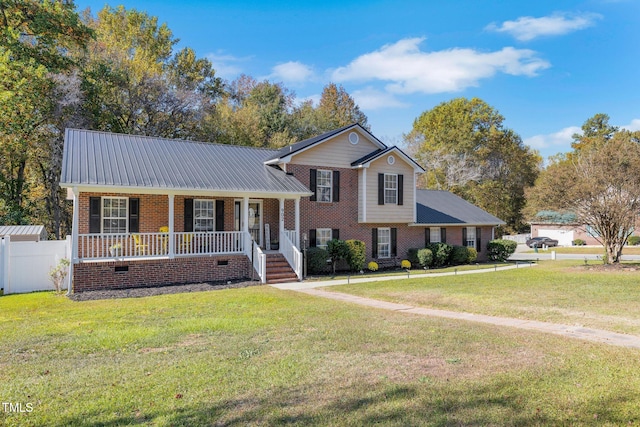 view of front facade with a front yard and covered porch