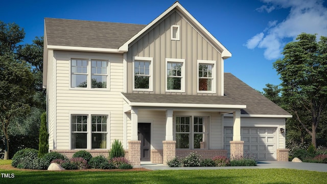 view of front of house featuring a garage and a front lawn