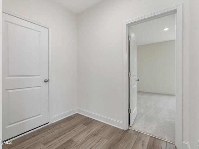 empty room featuring baseboards and wood finished floors