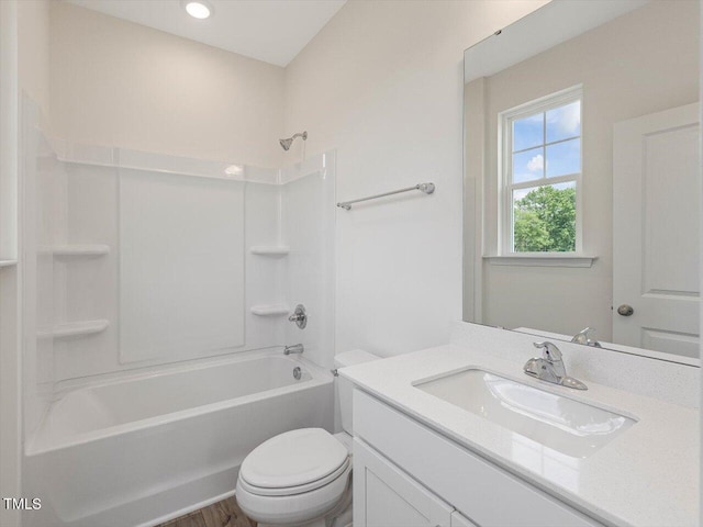 bathroom with shower / bath combination, vanity, and toilet