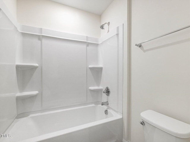 bathroom featuring washtub / shower combination and toilet