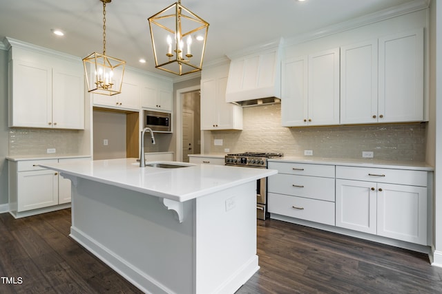 kitchen with stainless steel appliances, a sink, white cabinetry, and custom range hood