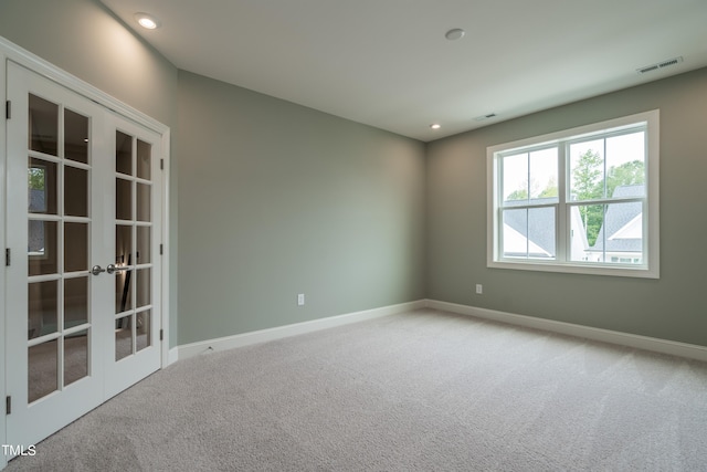 empty room with baseboards, visible vents, carpet flooring, french doors, and recessed lighting