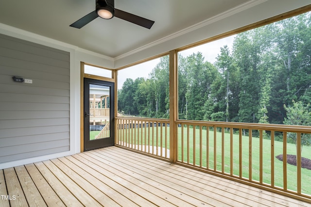 unfurnished sunroom with plenty of natural light and ceiling fan