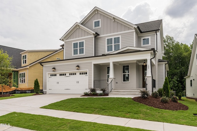 craftsman-style house with concrete driveway, an attached garage, covered porch, a front lawn, and board and batten siding