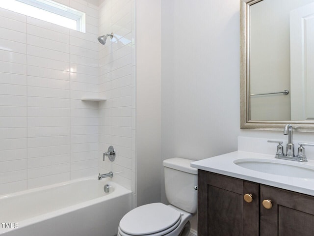 bathroom with toilet, shower / bath combination, and vanity