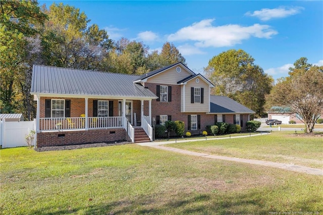 view of front of home featuring covered porch and a front lawn