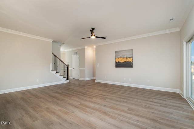 35 Uptown Rd, Zebulon, NC 27597 - unfurnished room with wood finished floors, stairway, crown molding, and ceiling fan